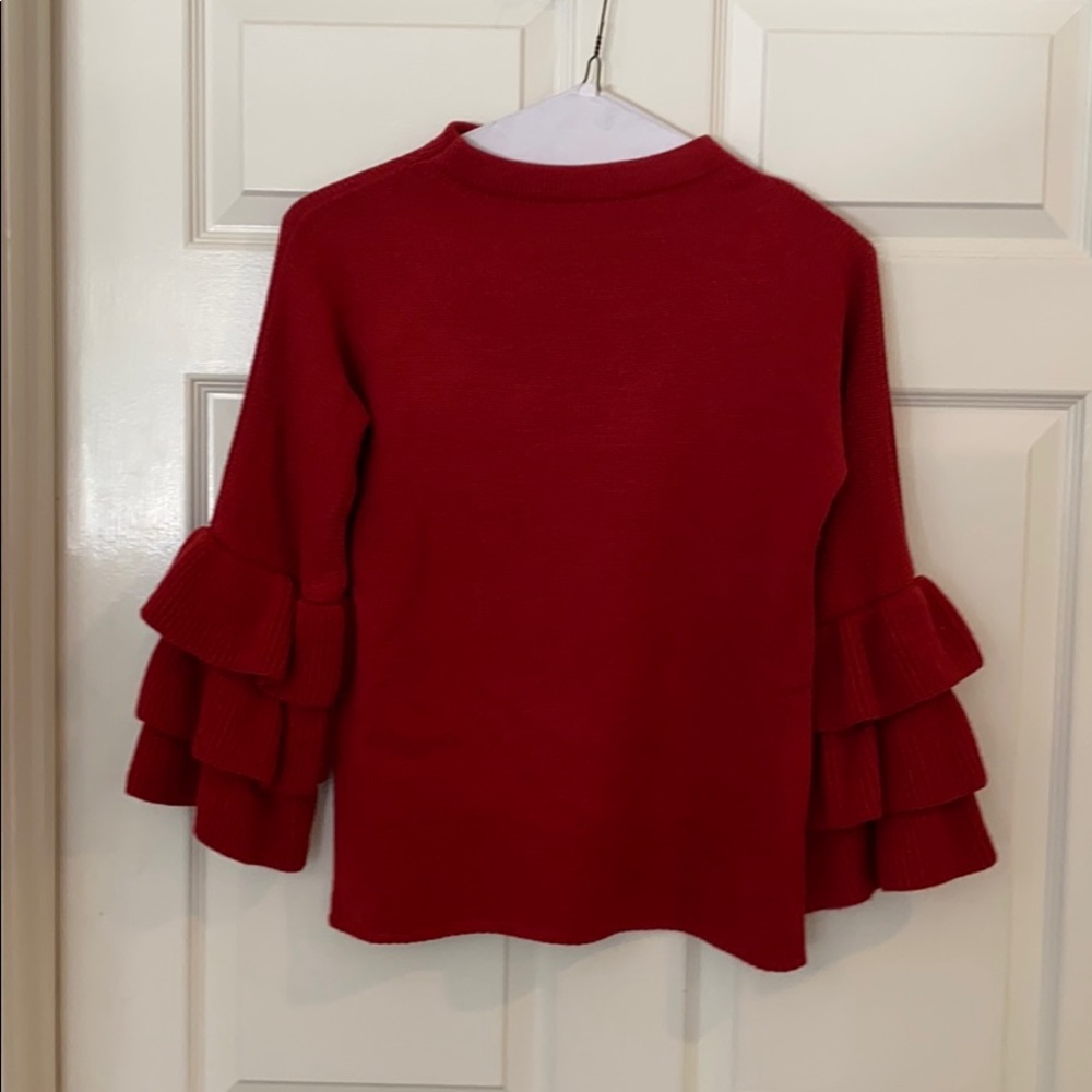 Red sweater with flare sleeves